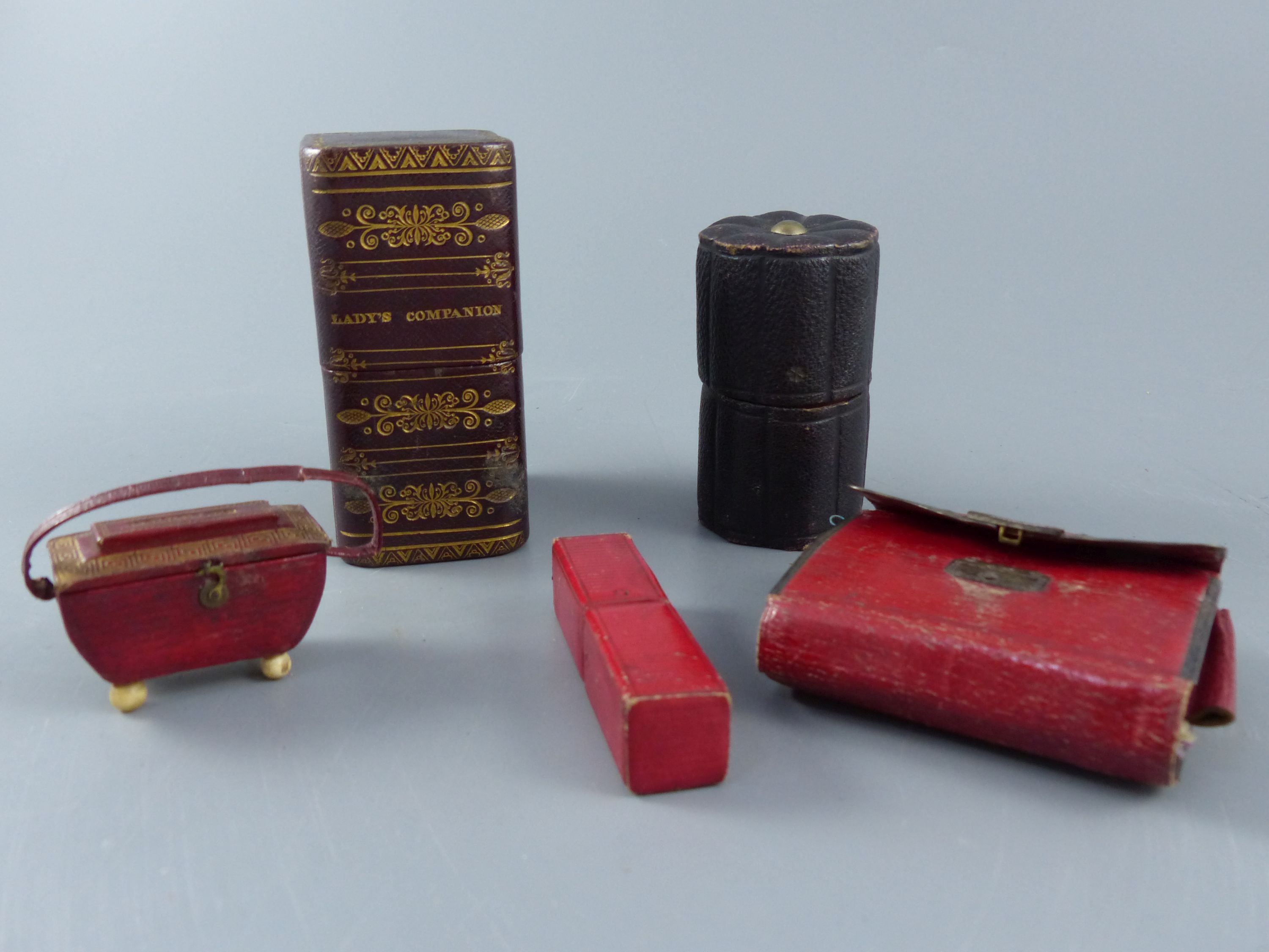 A group of early 19th century and later leather sewing cases